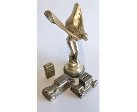 Two Cast Brass Motor-Cars,  both nickel-plated, one example being a money box. Also, a dashboard mounted vesta box holder, a 