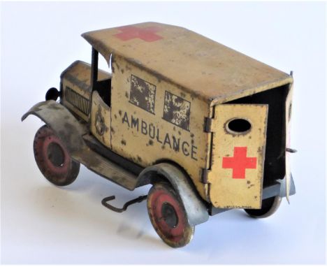 Ambulance Mechanical Toy  by Wells-Brimtoy, having opening rear doors, driver, spring-drive to the rear wheels, original grap