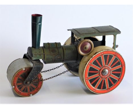 Steam-Powered Road Roller A spring-wound toy with original graphics and lining, retaining its steering chain, chimney and spi