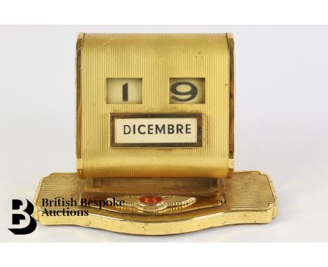 An Italian Bentley showroom perpetual desk calendar from a Bentley retail showroom, plated finish, measures approx. 10cms.