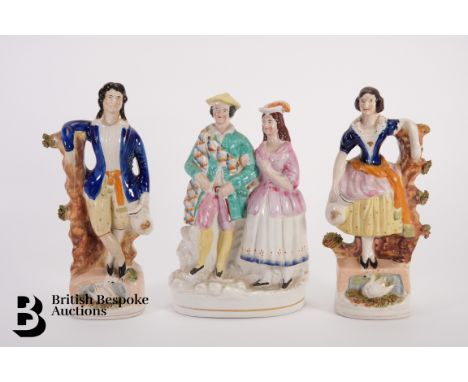 Staffordshire figures, 19th century, including a figural group of a couple approx 22.5 h x 15 w cms; and two figures of a man