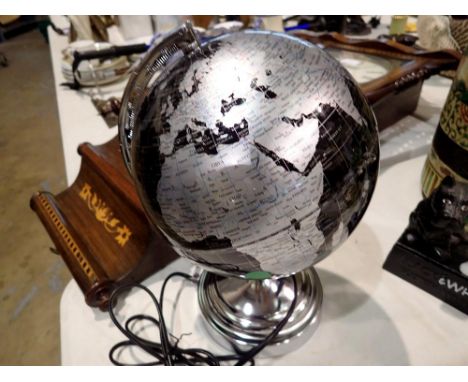 Illuminated black and silver globe, D: 21 cm. All electrical items in this lot have been PAT tested for safety and have passe