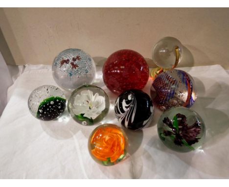 Collection of nine glass paperweights includes Caithness tartan twist example. Not available for in-house P&amp;P 