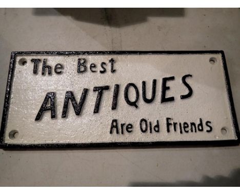 Cast iron The Best Antiques are Old Friends sign. D: 22 cm. UK P&amp;P Group 1 (£16+VAT for the first lot and £2+VAT for subs
