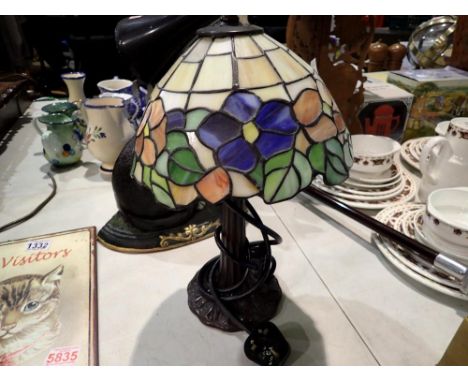 Tiffany style lamp on a metal tree trunk base, H: 42 cm. Not available for in-house P&amp;P 