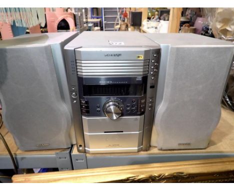 Sharp XL-HP535 5CD changer stereo and speakers. All electrical items in this lot have been PAT tested for safety and have pas