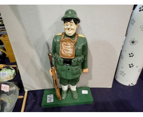 Painted composition figurine of Oliver Hardy in uniform, based on the 1938 Blockheads movie character, H: 35 cm. UK P&amp;P G