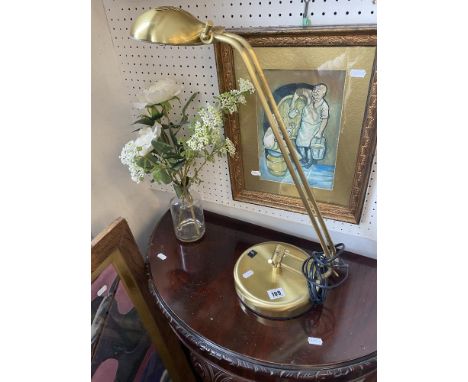 A brass desk lamp
