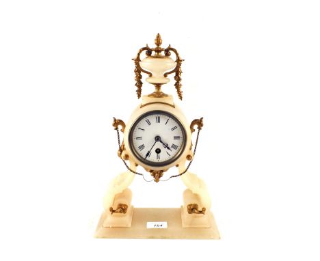 An alabaster and gilt metal mantel clock with urn finial