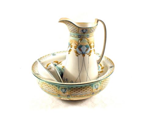 An Art Nouveau floral toilet set