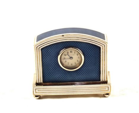 A Silver desk clock decorated with blue guilloche and white enamel