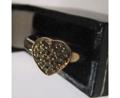 9ct yellow gold, heart shapped ring filled with green stones (probably peridots) Approx 2.2 grams gross,             size N/O