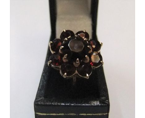 9ct yellow gold, garnet flower ring Approx 4.3 grams gross, size P