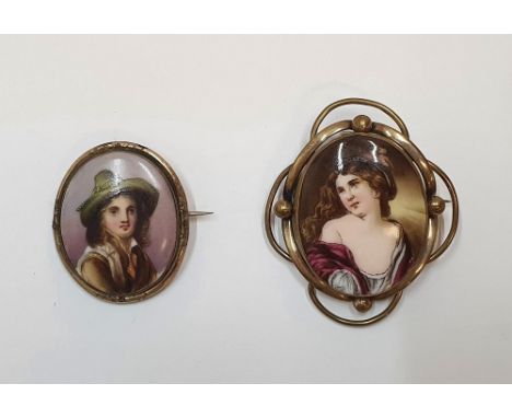 2 hand painted antique brooches on ceramic