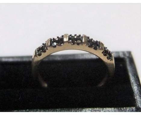unmarked/untested yellow gold ring with 20 small round cut black diamonds Approx 1.7 grams gross,          size P/Q 