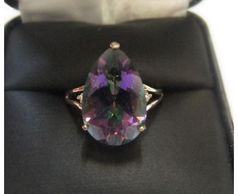 9ct yellow imported gold ring with large pear cut mystic topaz with a small diamond to either flankApprox 2.1 grams gross,   