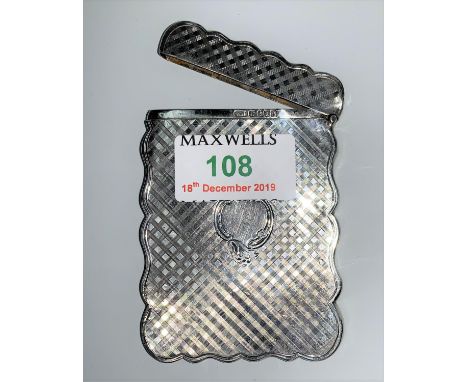 A silver engine turned card case, shaped rectangular form, Birmingham 1897, 2 oz 