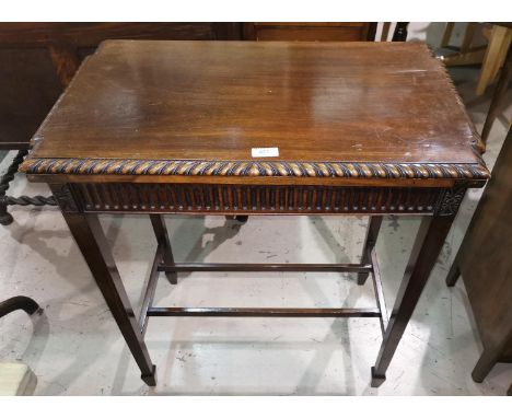 An early 20th mahogany side/card table, the fold-over top with gadrooned rim, on square legs 