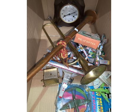 An ornamental horn and bugle; a Smith's chiming clock; a selection of diecast airplanes; tinplate toy sets 