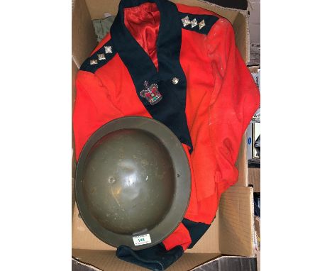 A WWI style helmet; a soldier's dress jacket; a US Army jacket 