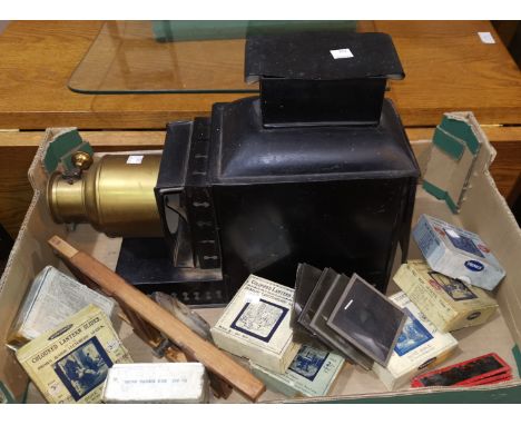 An early 20th century magic lantern projector and 8 sets of lantern slides 