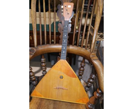A balalaika, an enamel bread bin 