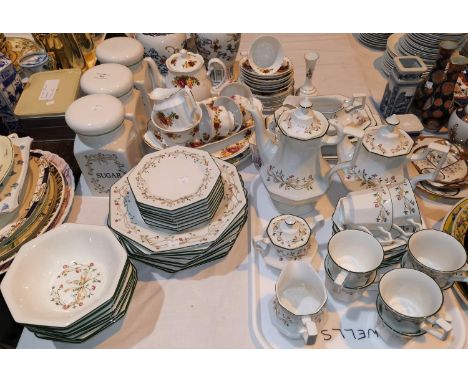An Eternal Beau tea service by Johnson Bros; another tea service decorated with roses; a brass oil lamp 