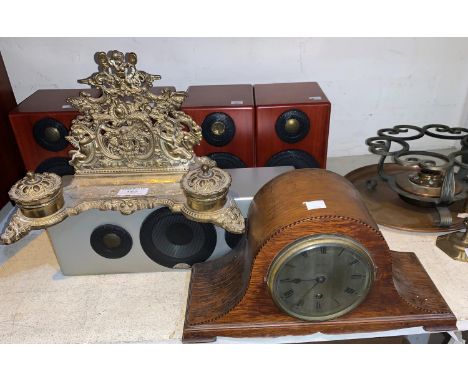 A brass desk organiser with letter rack and inkwell; an oak cased clock by Finnigan's of Manchester 