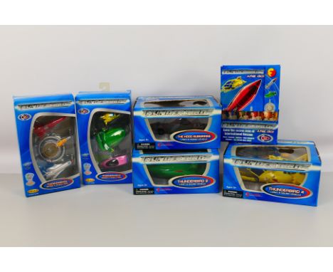 Universal - Thunderbirds - A collection of 6 items based on the Thunderbirds film 2004 to include two Diecast 3 vehicle pack;