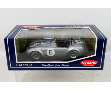 Kyosho - A boxed Kyosho #08041S 1:18 scale diecast Cobra 427 S/C Racing. The model shows dusty signs of display appearing Goo