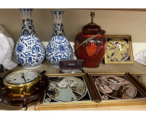 A set of four Art Nouveau inspired pottery tiles depicting the four seasons together with an Exodus pattern lamp base, blue a