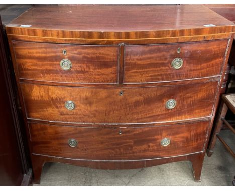 A George III mahogany chest, the D shaped top above two short and two long drawers on splayed bracket feet