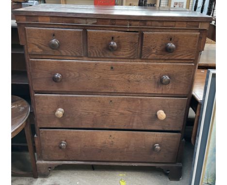 A 19th oak chest, the rectangular top above three short and three long graduated drawers on bracket feet
