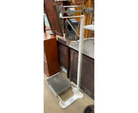 A white painted scales with platform base