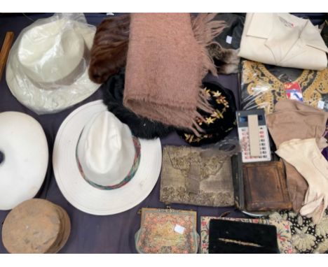 A fur stole together with hats, scarf, buttons, gloves, purses, geometry sets etc
