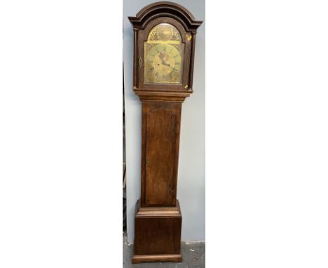 A 19th century oak longcase clock, the domed hood above a long trunk door with ogee arch, box base and bracket feet, the 30.5