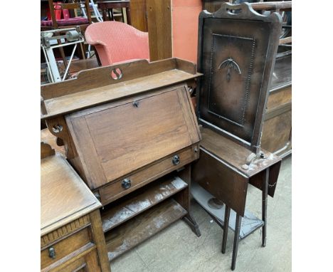 A 20th century oak bureau together with an oak gateleg table and a firescreen