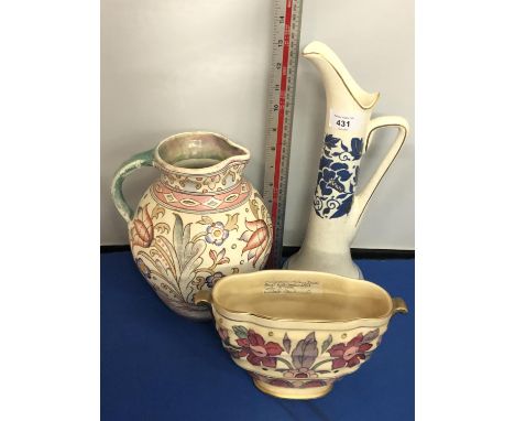 A CHARLOTTE RHEAD CROWN DUCAL TALL BLUE TALL JUG, ANOTHER BALUSTER JUG AND A FLORAL DECORATED VASE 