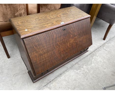 A GLOBE WERNICKE OAK TABLE TOP BUREAU WITH ONE DRAWER AND INNER FITTINGS 