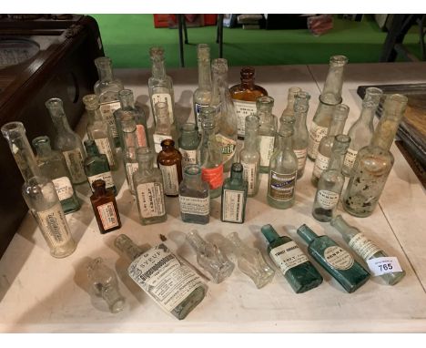 A COLLECTION OF VINTAGE BOTTLES SOME WITH LABELS 