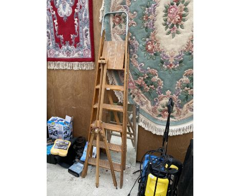 A SET OF VINTAGE WOODEN STEP LADDERS, A WOODEN EASEL AND AN UNFRAMED MIRROR 