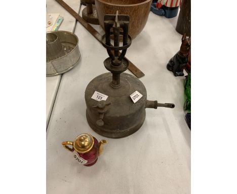 A VINTAGE BRASS LAMP AND A SMALL LIMOGES TEAPOT 