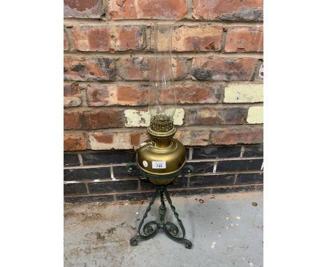 AN ARTS AND CRAFTS BRASS AND METAL OIL LAMP 
