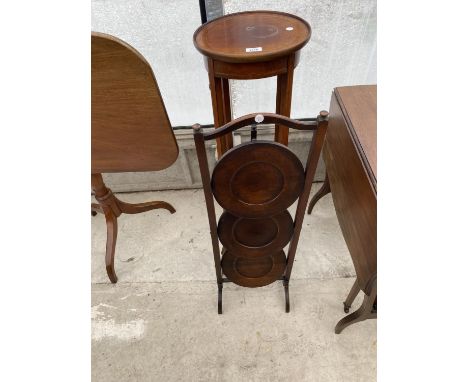 A FOLDING OAK THREE TIER CAKE STAND AND AN INLAID MAHOGANY PLANT STAND WITH LOWER SHELF 