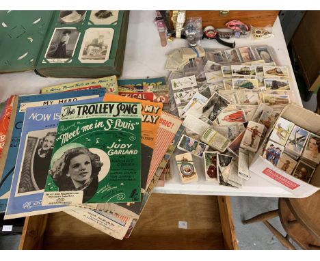 A COLLECTION OF CIGARETTE CARDS MOSTLY PLAYERS AND VINTAGE MAGAZINES AND SHEET MUSIC 