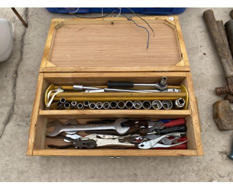 A WOODEN CASE CONTAINING SOCKETS, TOOLS ETC 