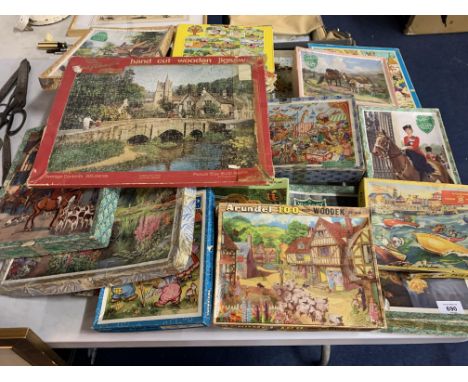 A LARGE COLLECTION OF VINTAGE WOODEN JIGSAWS 
