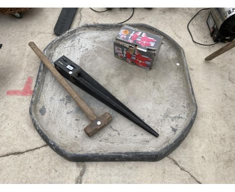A MIXING BASE, SLEDGE HAMMER, POST SUPPORT AND A BENCH VICE 