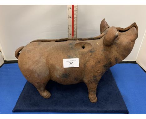 A VINTAGE CAST IRON PIG APPROXIMATELY 14 INCHES LONG 