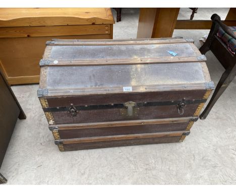 A WOOD BOUND TRAVEL TRUNK 